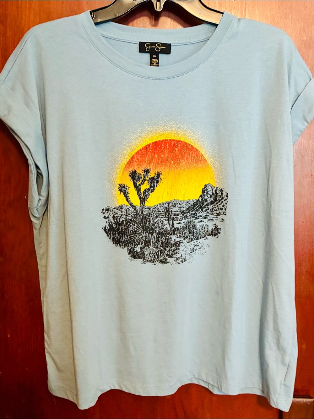 Jessica Simpson Light Blue Tee with Yellow and Orange Sunset Desert Graphic